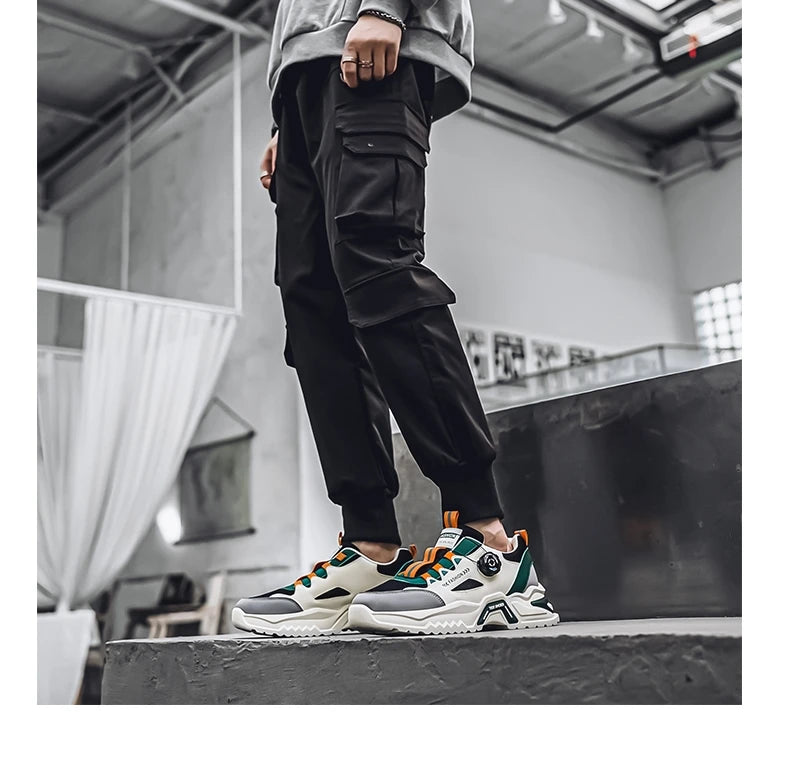 Koreanische Herren-Sportschuhe mit drehbarer Schnalle, modische Freizeitschuhe für alle Jahreszeiten, weiche rutschfeste Sohle, Outdoor-Laufschuhe, Studenten-Sneaker