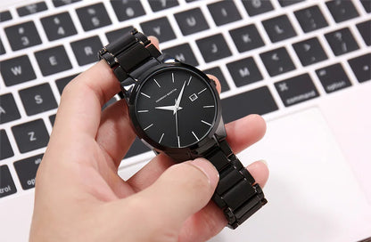 Montre pour homme Hannah Martin, boîtier en acier inoxydable, mouvement à quartz, cadran de 41 mm, style professionnel, avec affichage du calendrier (imitation)
